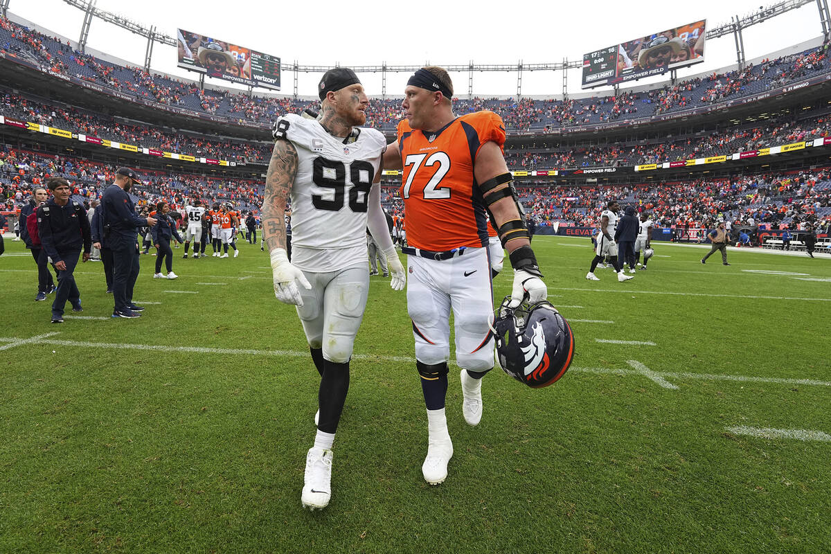 Las Vegas Raiders defensive end Maxx Crosby (98) and Denver Broncos offensive tackle Garett Bol ...