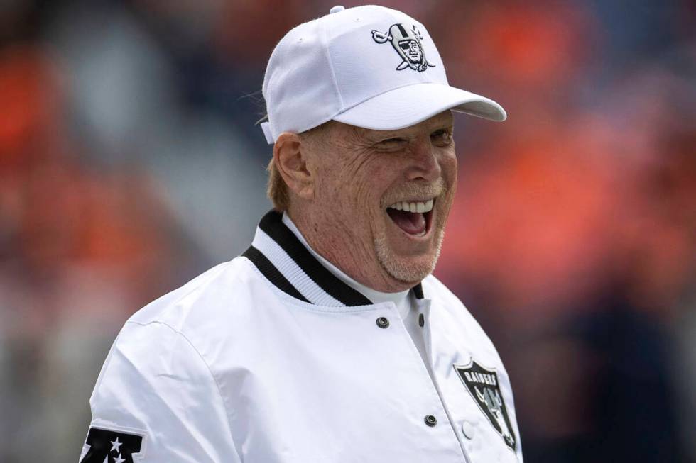 Raiders owner Mark Davis laughs from the sideline before the start of an NFL game against the D ...