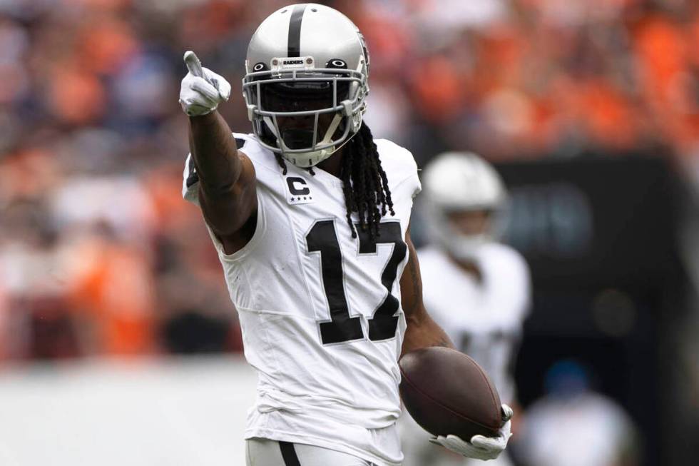 Raiders wide receiver Davante Adams (17) points to signal for a first down during the first hal ...