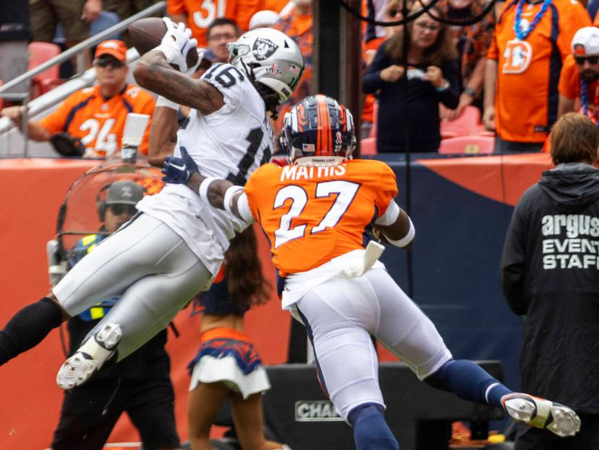 Raiders wide receiver Jakobi Meyers (16) scores a touchdown over Denver Broncos cornerback Dama ...