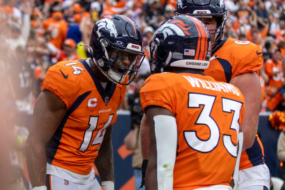 Denver Broncos wide receiver Courtland Sutton (14) celebrates his touchdown score with Denver B ...