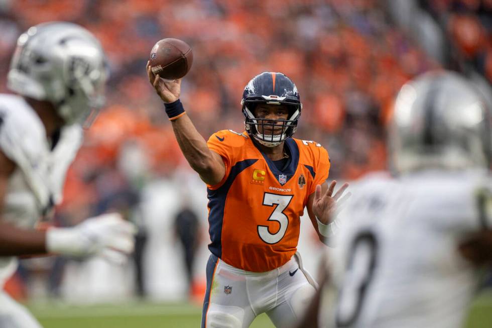 Denver Broncos quarterback Russell Wilson (3) makes a throw during the second half of an NFL ga ...