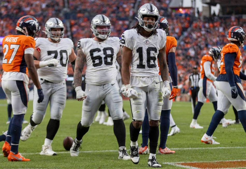 Raiders wide receiver Jakobi Meyers (16) celebrates his second touchdown score of the day durin ...