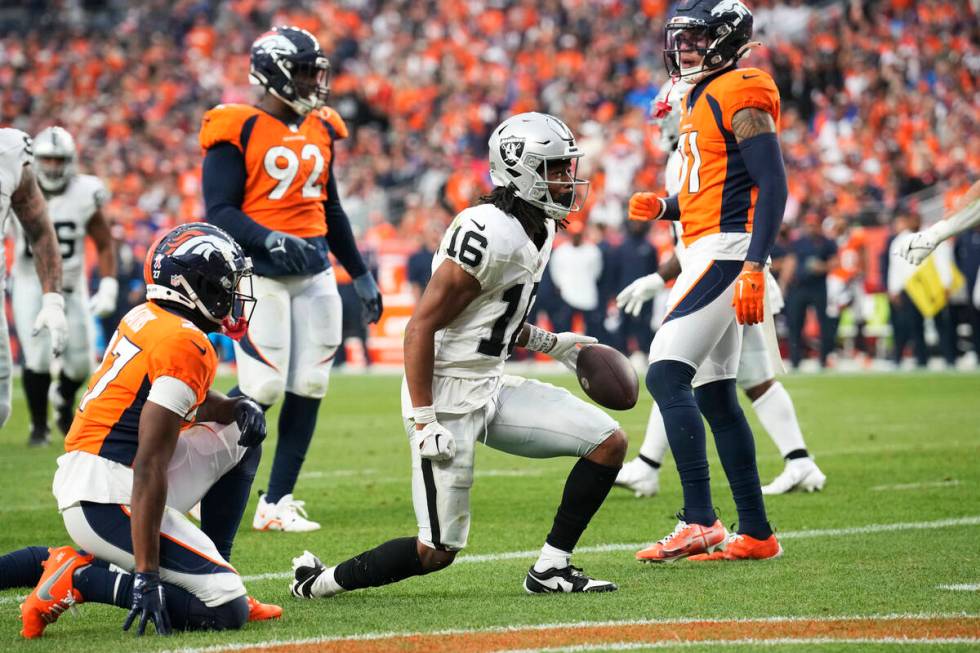 Las Vegas Raiders wide receiver Jakobi Meyers (16) holds the ball after making a touchdown catc ...