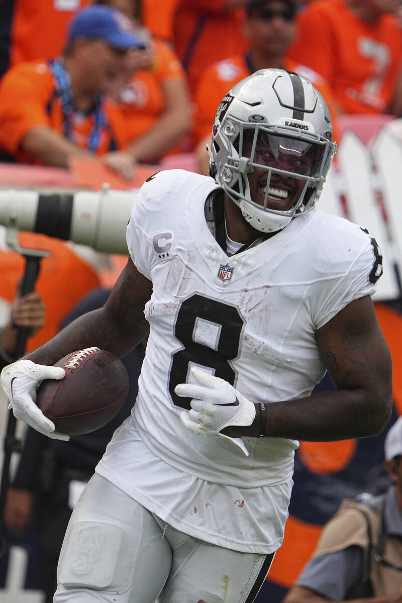 Las Vegas Raiders running back Josh Jacobs (8) celebrates against the Denver Broncos of an NFL ...