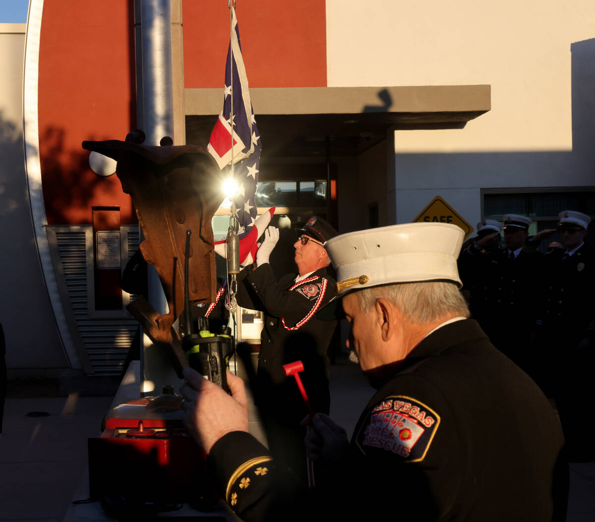 Former Las Vegas Fire and Rescue Spokesperson Tim Szymanski performs the tolling of the bell as ...