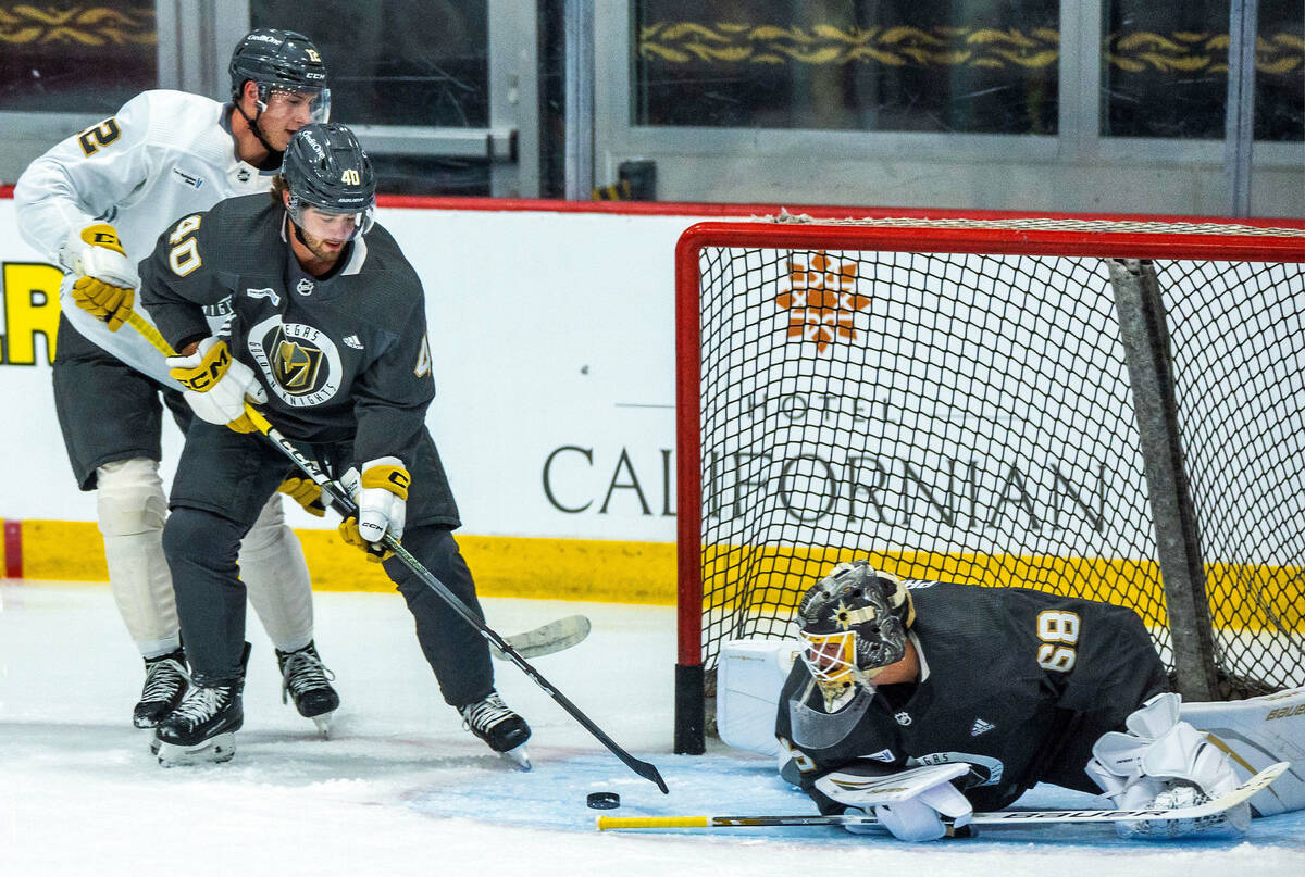 Golden Knights rookie defenseman Lukas Cormier (40) eyes a shot attempt on goalie Jordan Papirn ...