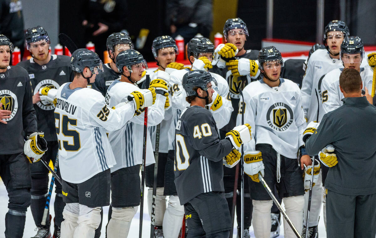 Golden Knights rookie defenseman Lukas Cormier (40) and forward Brendan Brisson (19) join teamm ...