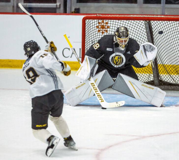 Golden Knights rookie forward Brendan Brisson (19) scores on goalie Jesper Vikman (32) during p ...