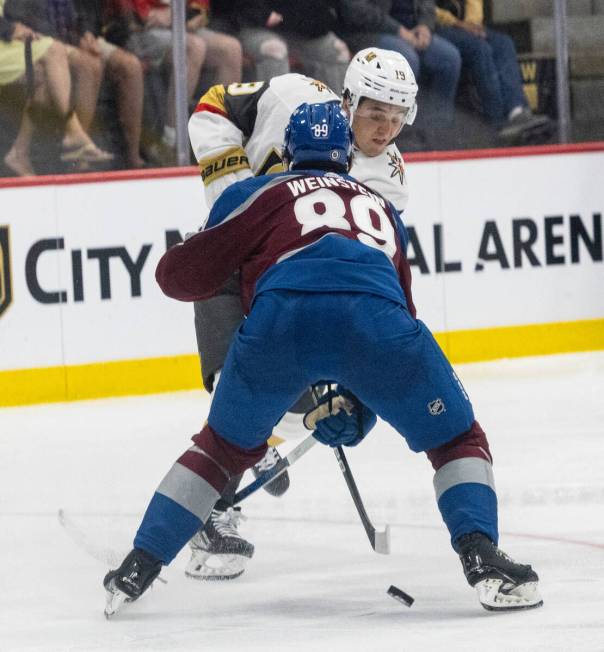 Golden Knights prospect forward Brendan Brisson (19) passes the puck between Colorado Avalanche ...