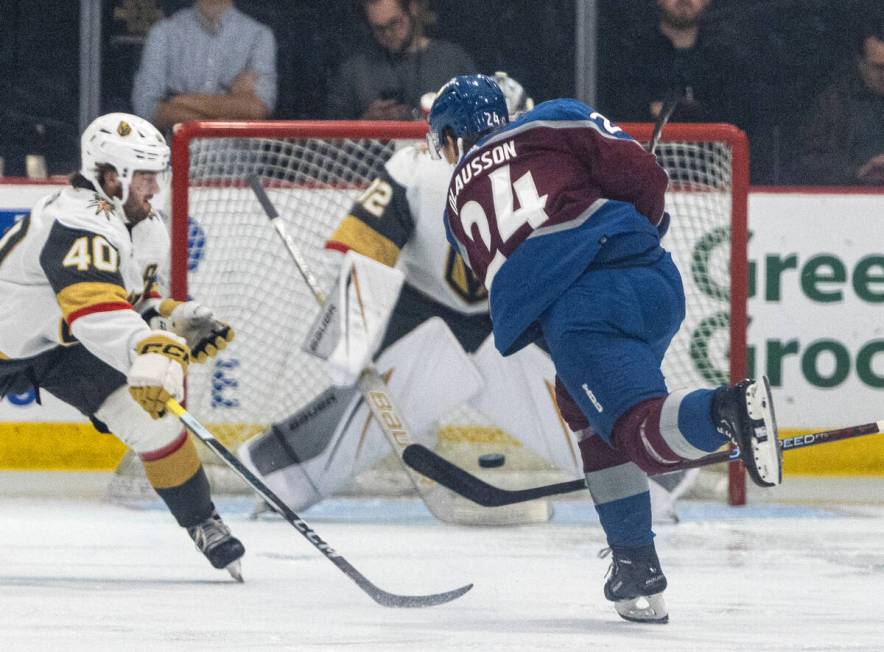 Colorado Avalanche Oskar Olausson (24) hits the puck against Golden Knights prospect goaltender ...