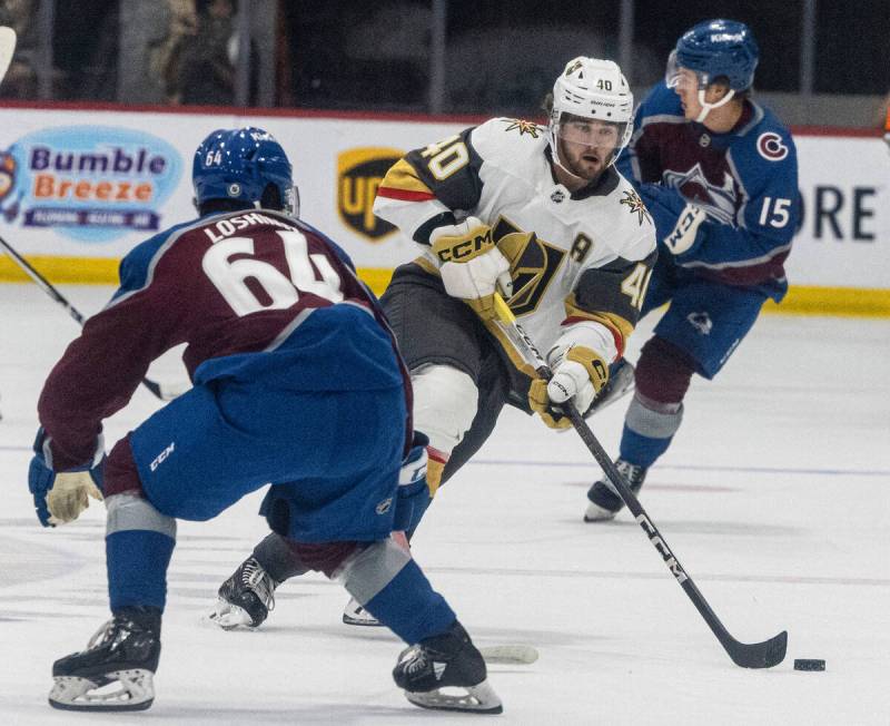 Golden Knights prospect defenseman Lukas Cormier (40) chases the puck as Colorado Avalanche Loa ...