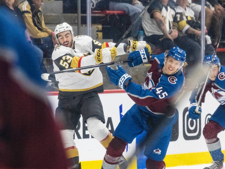 Golden Knights prospect forward Simon Pinard (53) and Colorado Avalanche Milo Roelens (45) coll ...