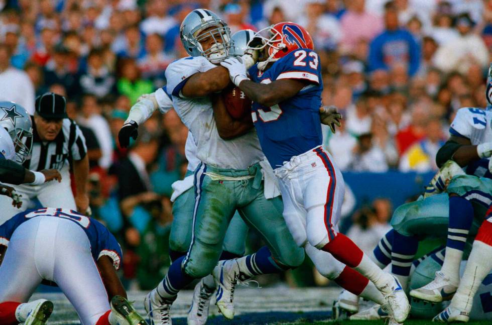 Dallas Cowboys Ken Norton, left, stops Buffalo Bills Kenneth Davis (23) at the goal line in fir ...