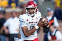 UNLV quarterback Doug Brumfield (2) looks to throw against Michigan in the first half of an NCA ...