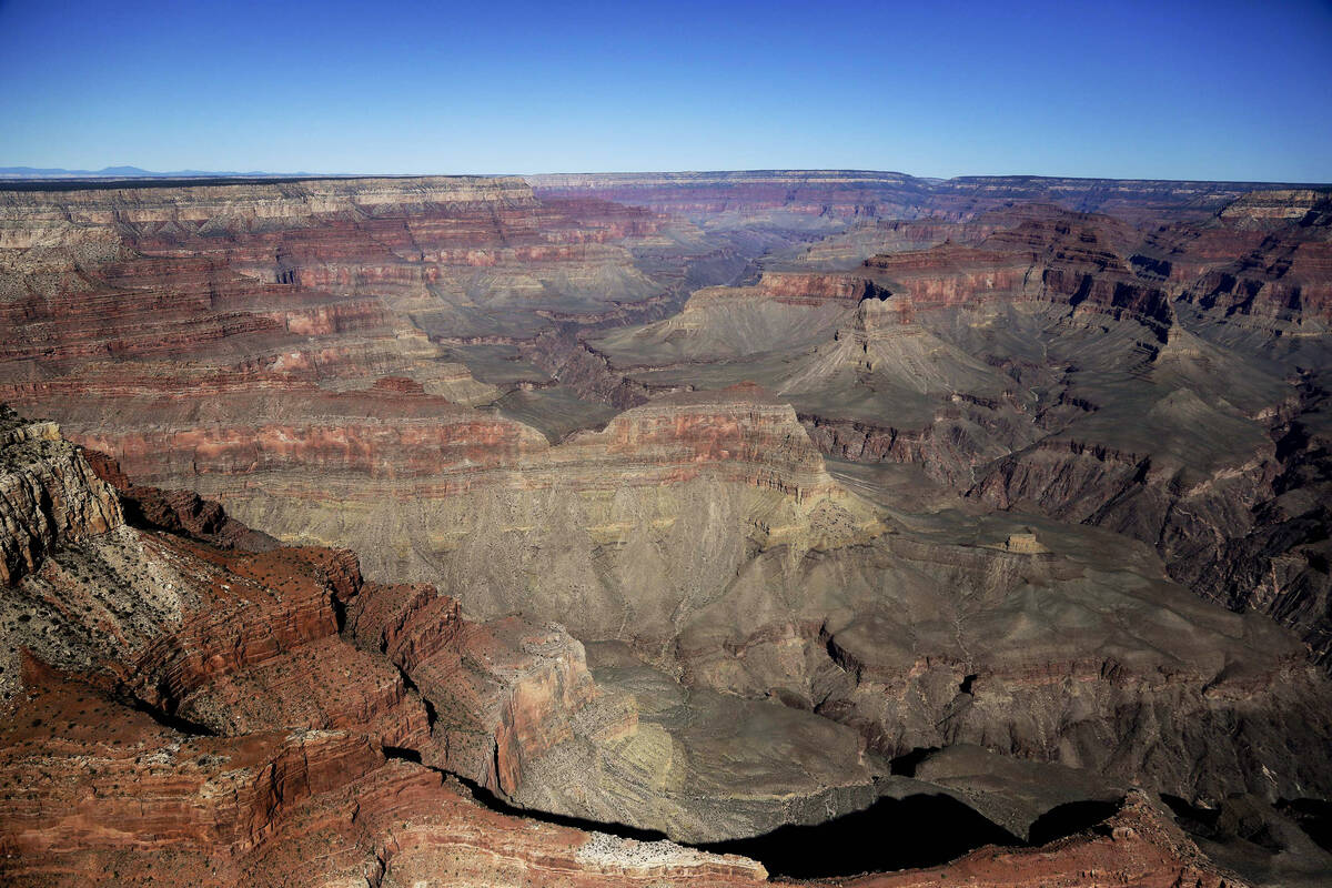 FILE - The Grand Canyon National Park is covered in the morning sunlight as seen from a helicop ...