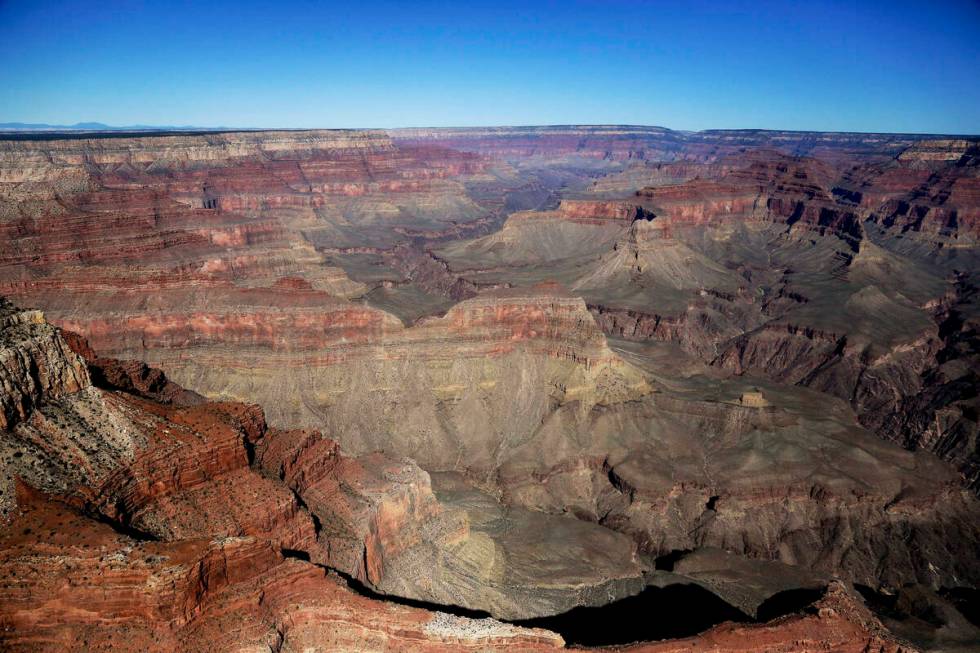 FILE - The Grand Canyon National Park is covered in the morning sunlight as seen from a helicop ...