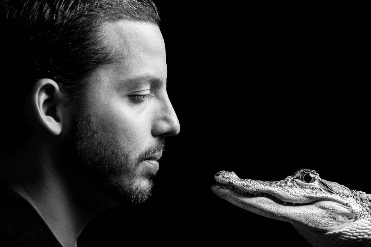 David Blaine is shown with the alligator he uses in his street-magic act. (Review-Journal file)