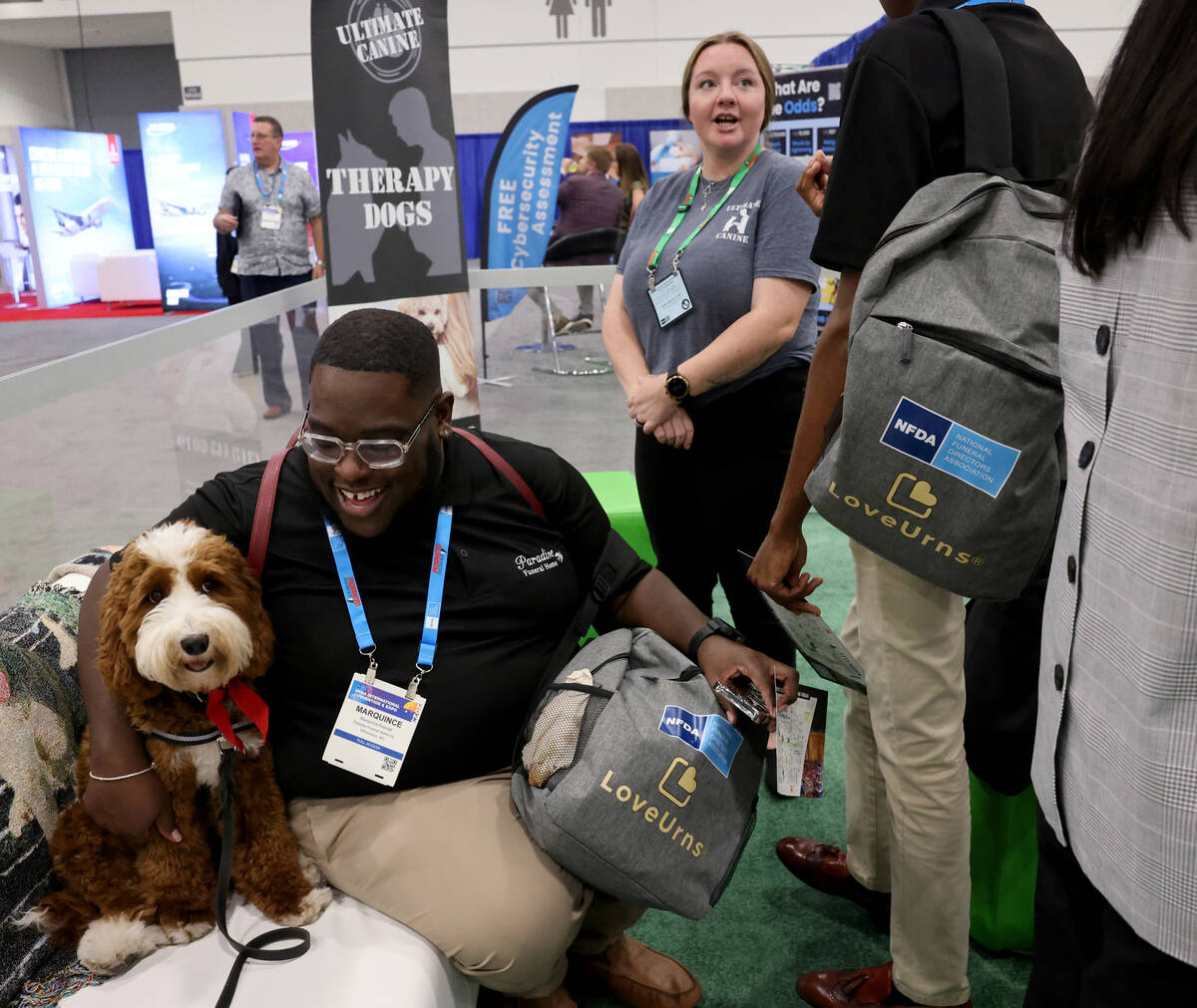 Marquince Pearsall of Paradise Funeral Home, Inc. in Williamston, N.C. visits with Paisley at t ...