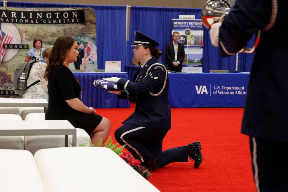 U.S. Air Force honor guard members demonstrate military funeral honors during the National Fune ...