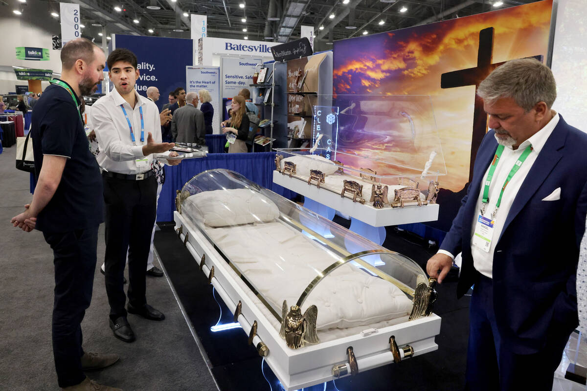 Matteo Fernandez of Clear View Caskets, second from left, talks to Jimmy Cardinal of Cardinal F ...