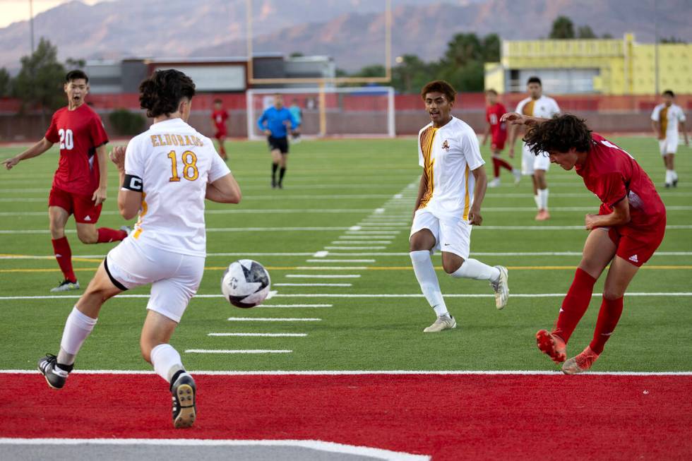 Arbor View's Bryce Rocha (7) kicks an attempted goal past Eldorado defender Luke Ostler (18) du ...