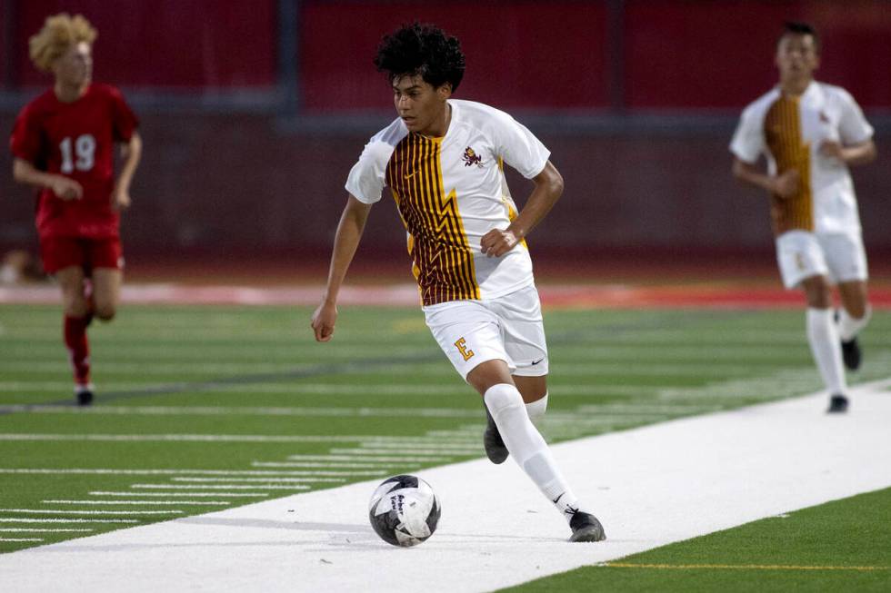 Eldorado midfielder Luis Martinez (10) dribbles up the field during a boys high school soccer g ...