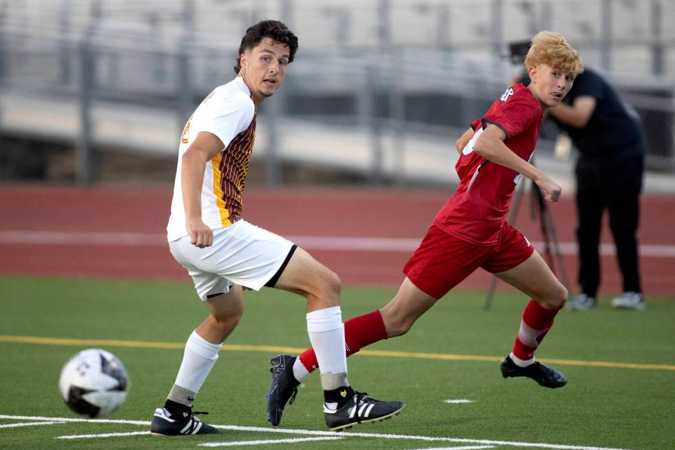 Eldorado defender Luke Ostler (18) watches the ball after Arbor View's Kyle Valentine (19) kept ...