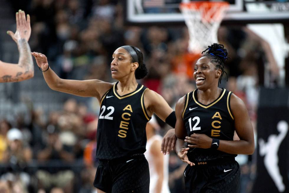 Las Vegas Aces guard Chelsea Gray (12) and Las Vegas Aces forward A'ja Wilson (22) celebrate af ...