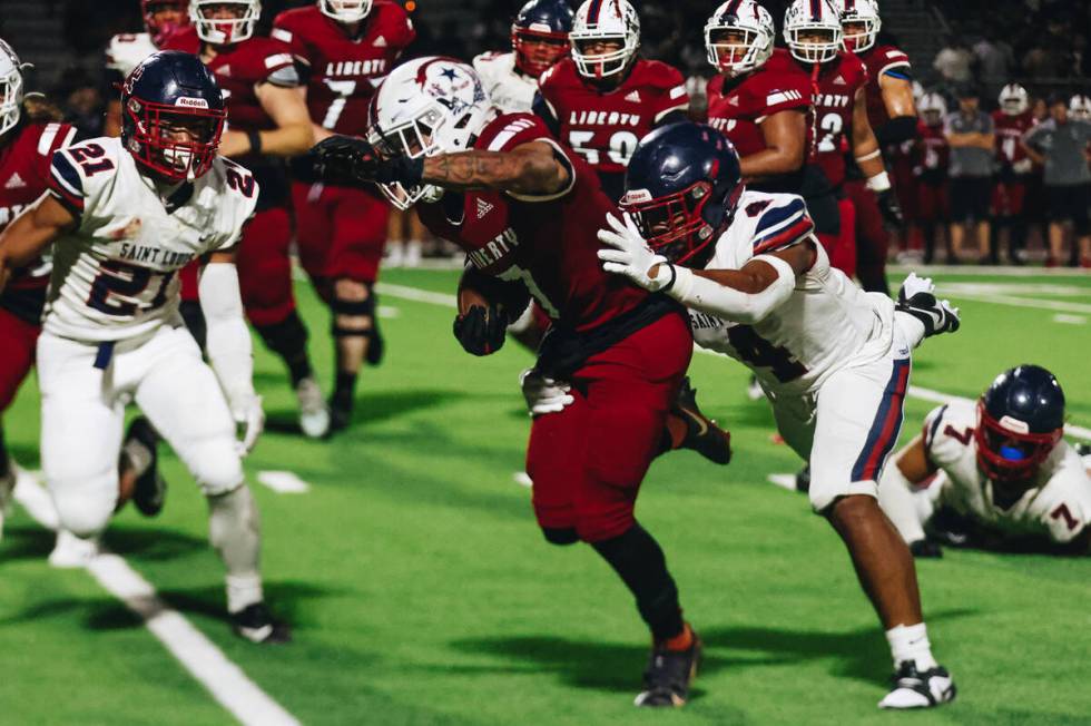 Liberty wide receiver Jayden Robertson (7) runs with the ball during an Island Classic game aga ...