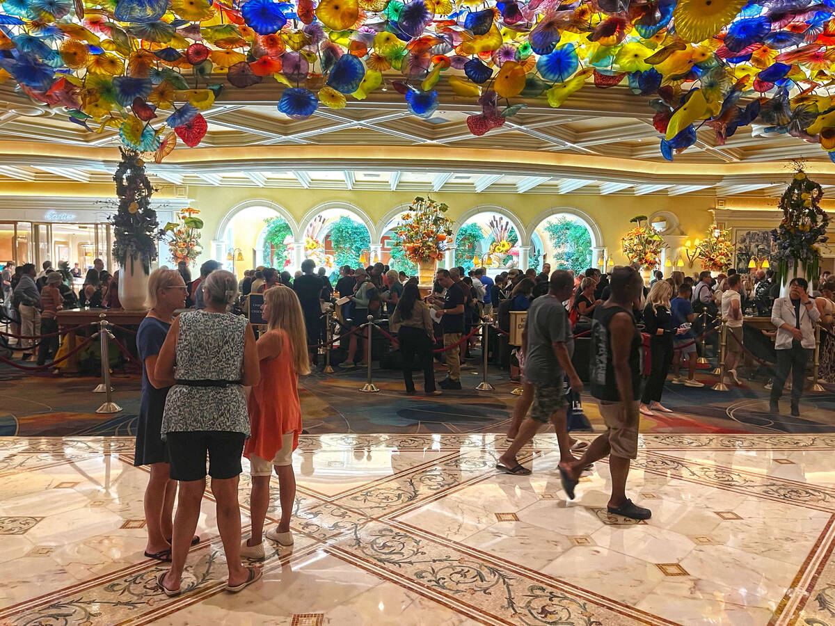 A crowd of people wait to check in with the front desk at the Bellagio on Wednesday Sept. 13, 2 ...