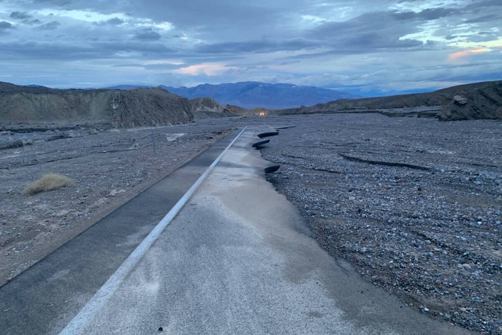 A damaged section of state Route 190 east of Furnace Creek at Death Valley National Park in Cal ...