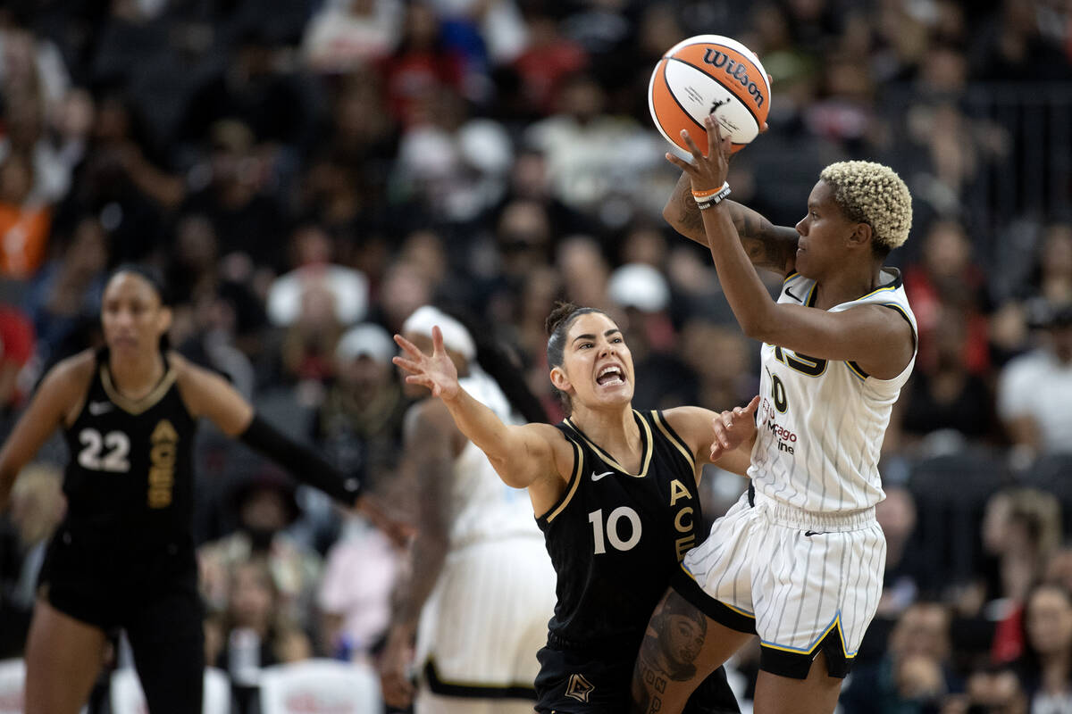 Las Vegas Aces guard Kelsey Plum (10) defends while Chicago Sky guard Courtney Williams (10) ju ...