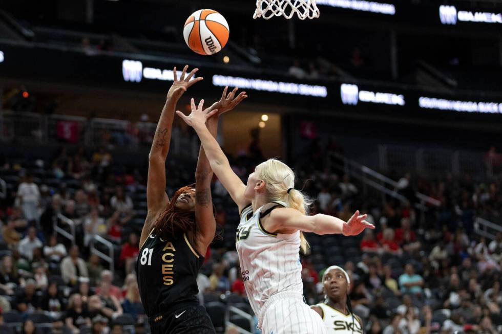 Las Vegas Aces center Alaina Coates (81) shoots against Chicago Sky forward Alanna Smith, right ...