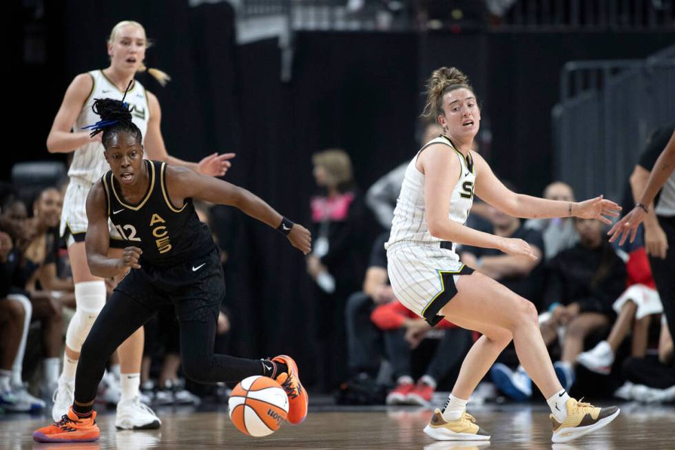 Las Vegas Aces guard Chelsea Gray (12) steals the ball from Chicago Sky guard Marina Mabrey, ri ...