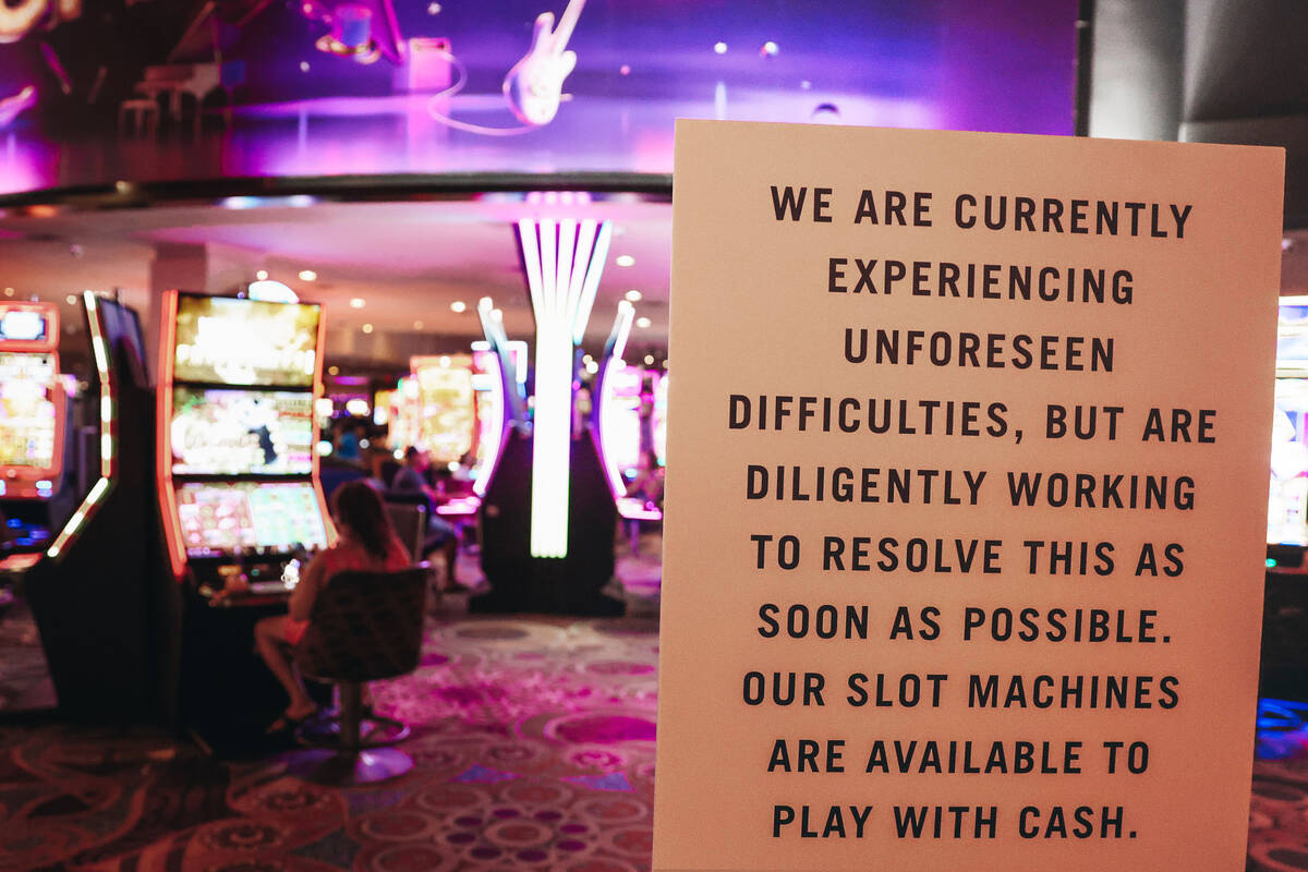 A sign warns guests of difficulties with gambling machines following a hack targeted at MGM Res ...