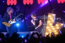 Brandon Flowers, right, and Dave Keuning perform with The Killers during a surprise appearance ...