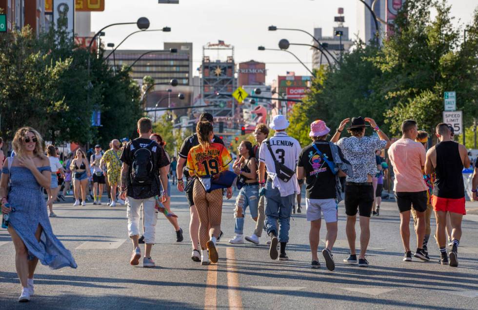 People walk along Fremont Street during day two of Life is Beautiful on Saturday, Sept. 18, 202 ...