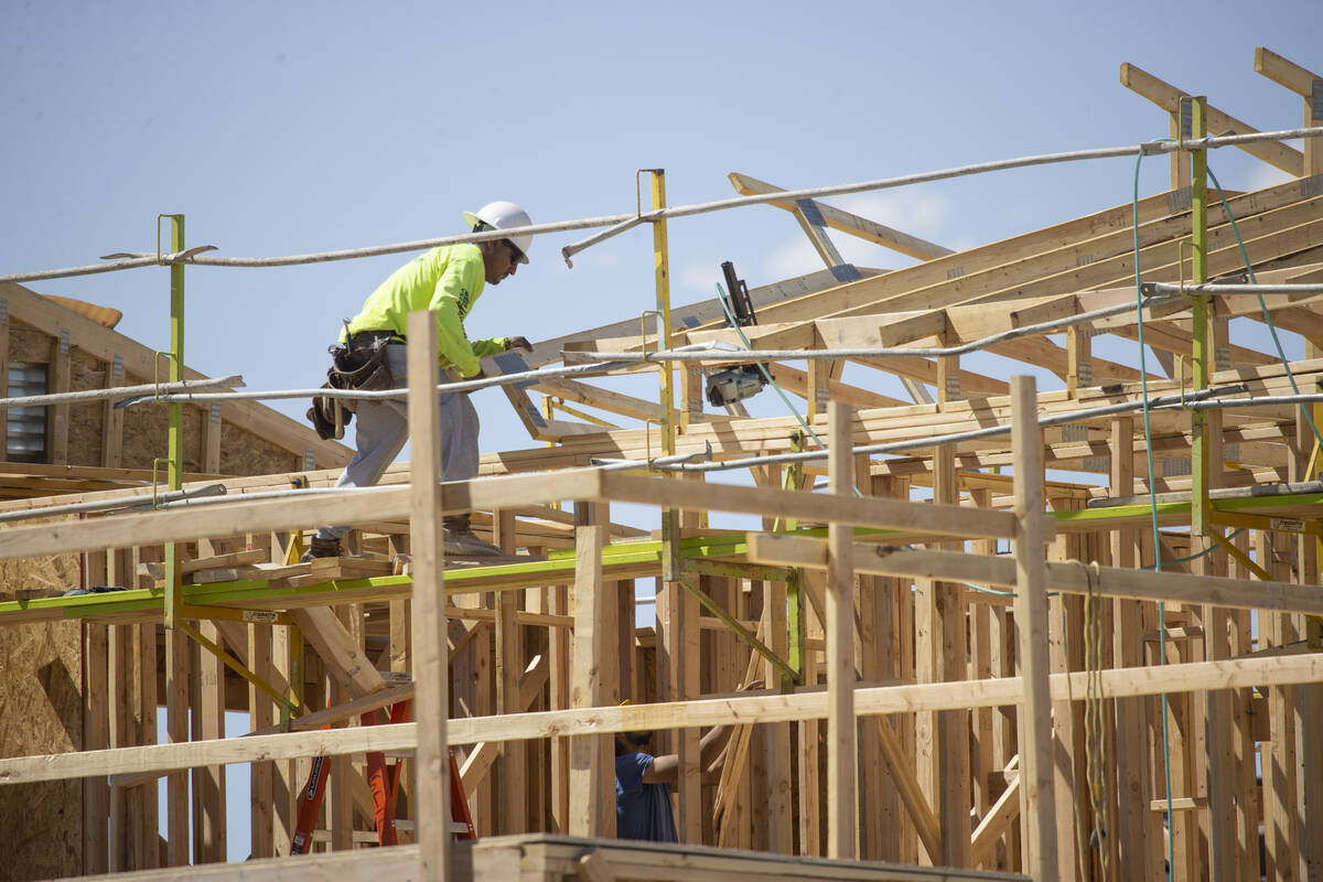 A construction worker builds the roof of a home in North Las Vegas on May 7, 2021. (Erik Verduz ...