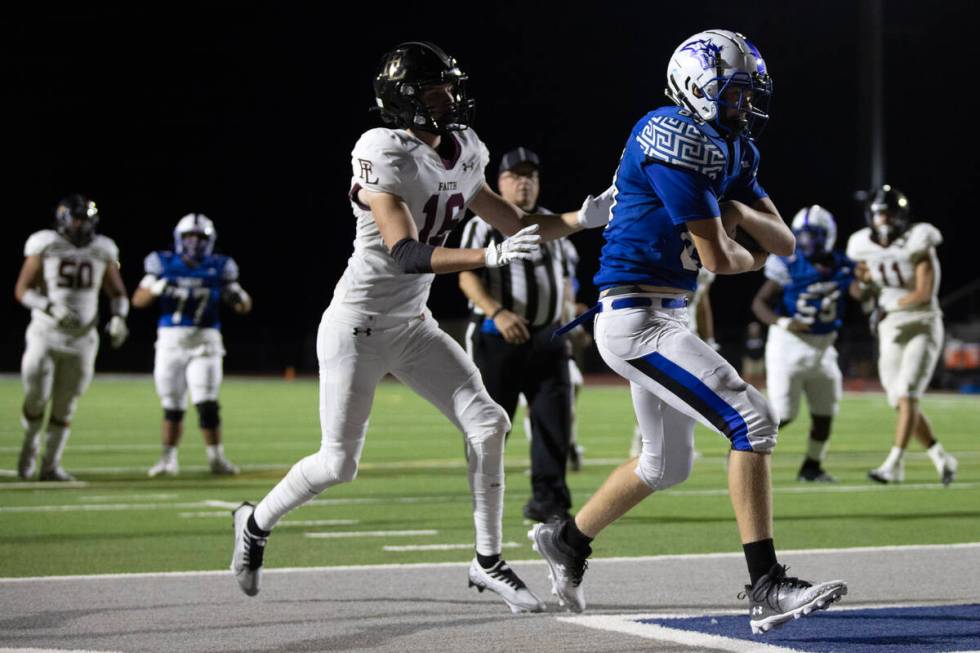 Basic wide receiver Hunter McGory (89) catches for a touchdown while Faith Lutheran’s Ma ...