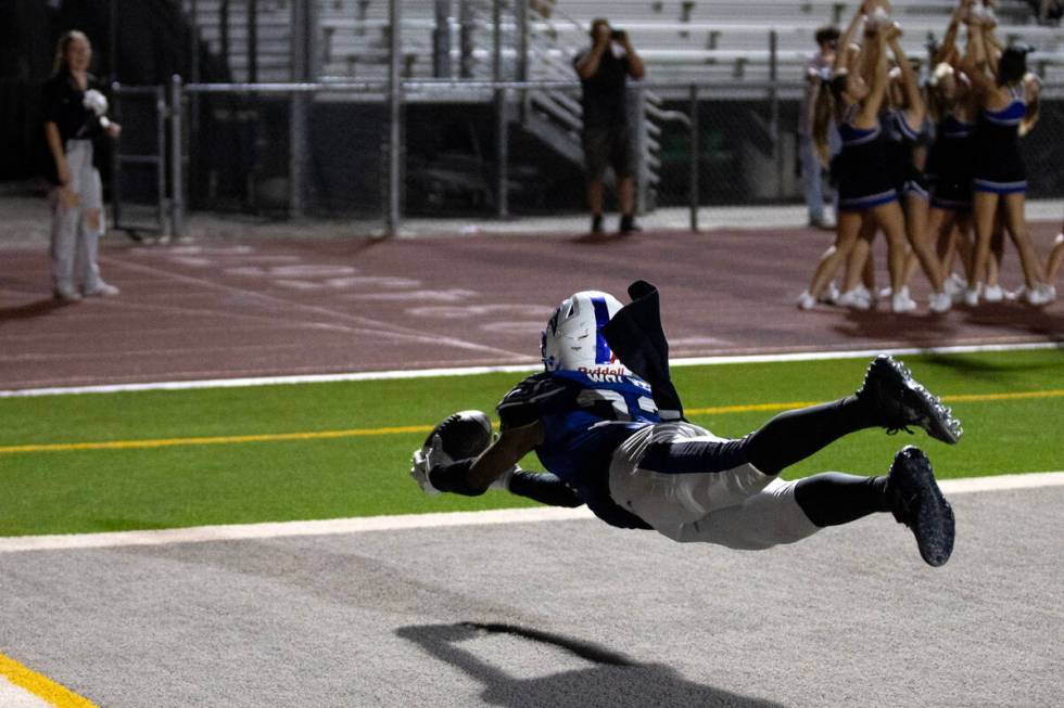 Basic wide receiver Zuri Whiters (23) dives to catch in the end zone during overtime in a high ...