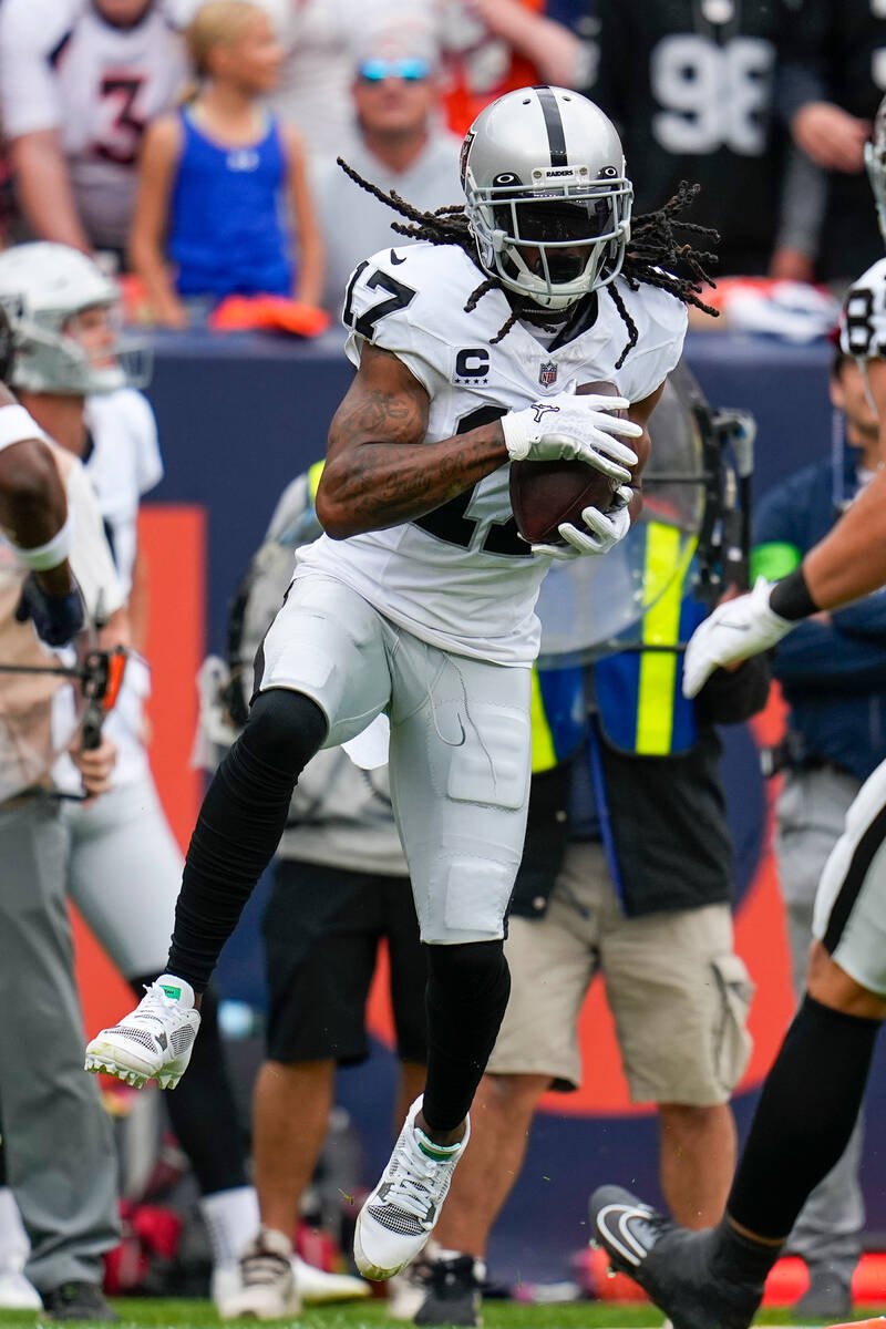 Las Vegas Raiders wide receiver Davante Adams (17) catches a pass against the Denver Broncos du ...