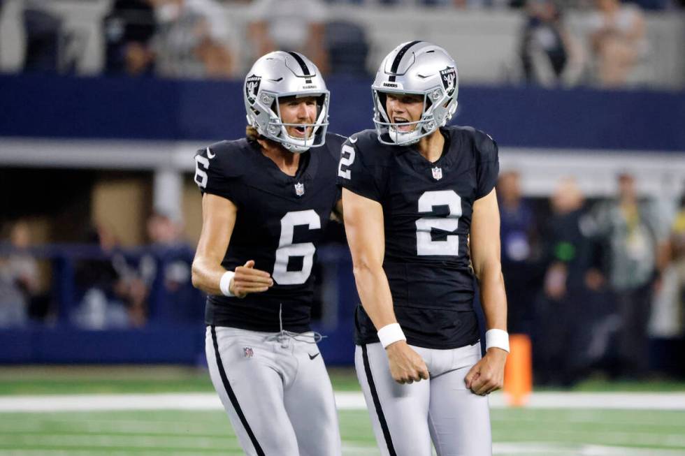 Las Vegas Raiders punter AJ Cole (6) and place kicker Daniel Carlson (2) celebrate after Carlso ...