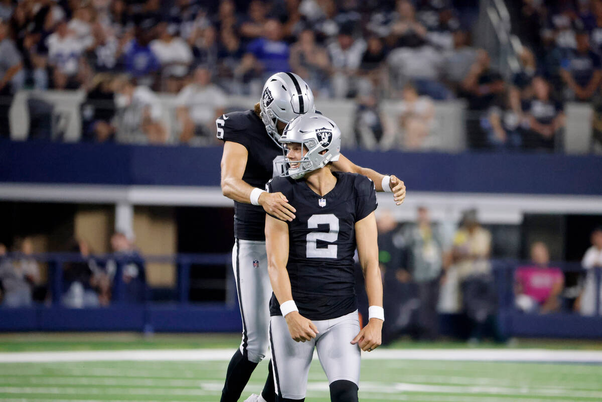 Las Vegas Raiders punter AJ Cole (6) and place kicker Daniel Carlson (2) celebrate after Carlso ...