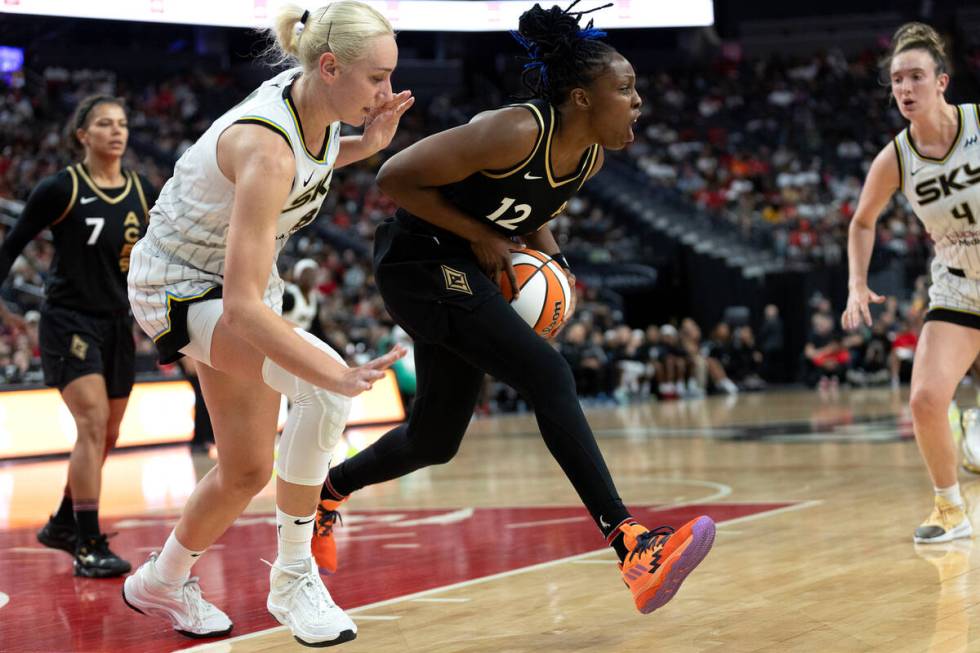 Las Vegas Aces guard Chelsea Gray (12) steals the ball from Chicago Sky forward Alanna Smith (8 ...