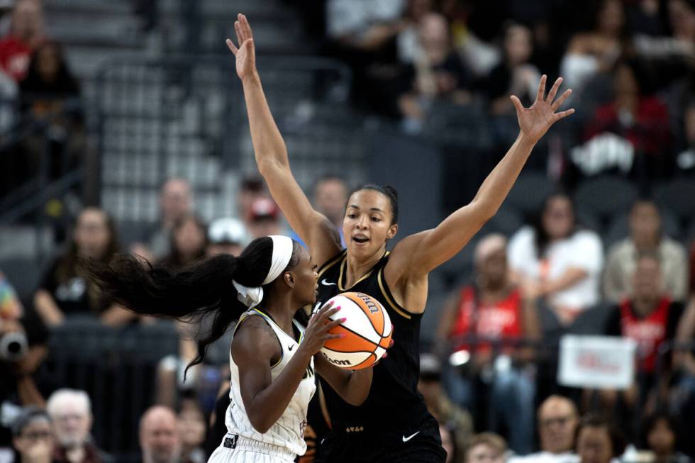 Las Vegas Aces center Kiah Stokes (41) guards Chicago Sky guard Dana Evans (11) during the firs ...