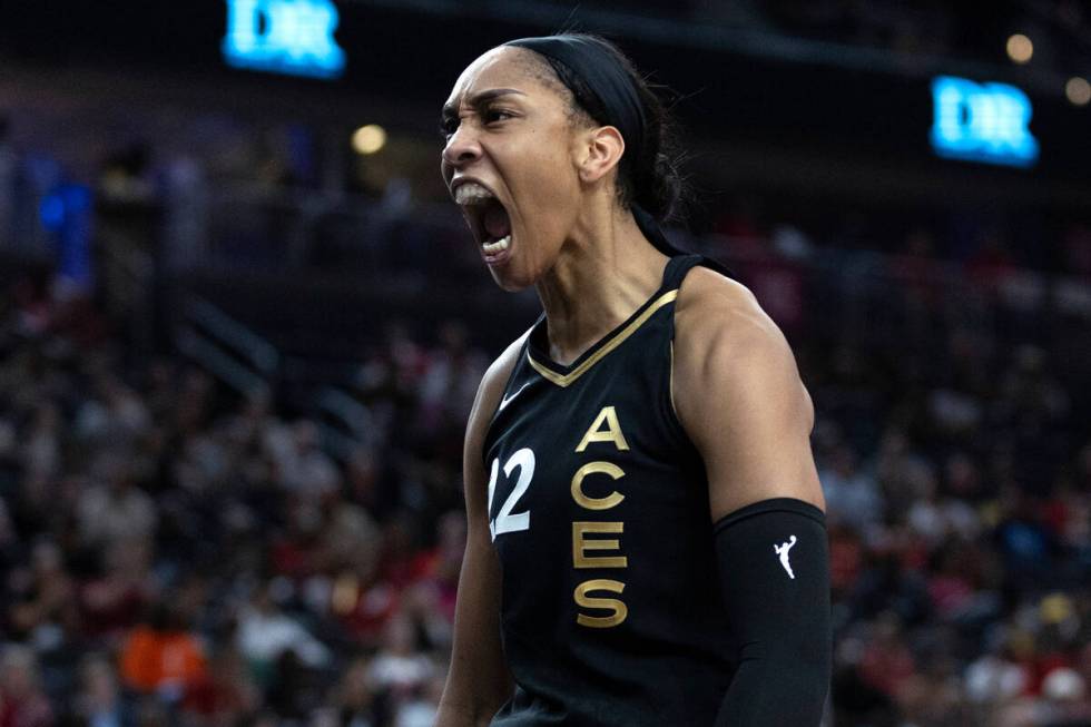 Las Vegas Aces forward A'ja Wilson (22) celebrates after blocking a Chicago Sky shot during the ...