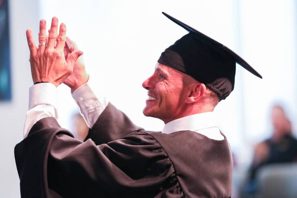 Michael Sollami claps for fellow graduates of the Law Enforcement Intervention for Mental Healt ...