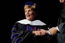 Former UNLV president Carol Harter receives an honorary decorate degree during the 2014 UNLV wi ...