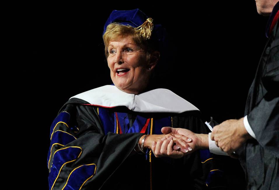 Former UNLV president Carol Harter receives an honorary decorate degree during the 2014 UNLV wi ...